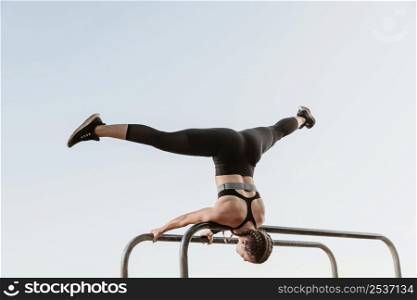 athletic woman doing fitness exercises outside