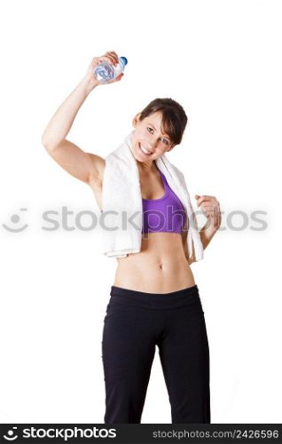Athletic woman holding a bottle of water and relaxing after doing exercise, isolated oin white