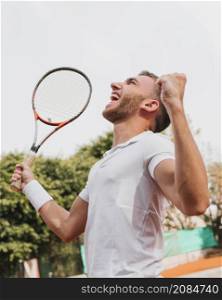 athletic young boy winning tennis game