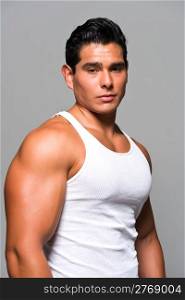 Athletic young man in a white undershirt