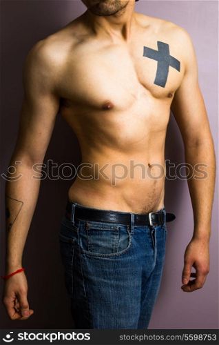 Athletic young man with tattoos