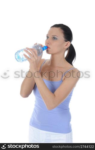 Athletic young woman drinking water from a bottle. Isolated on white background