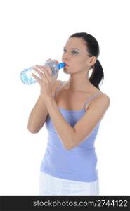 Athletic young woman drinking water from a bottle. Isolated on white background