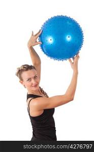 Athletic young woman with blue ball isolated on white