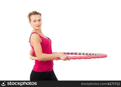Athletic young woman with hula hoop isolated on white