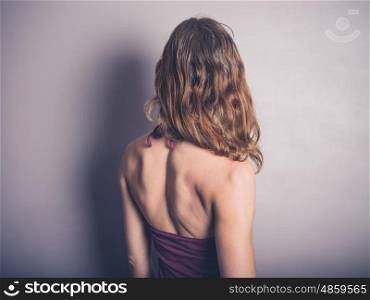 Athletic young woman with muscle definition in her back