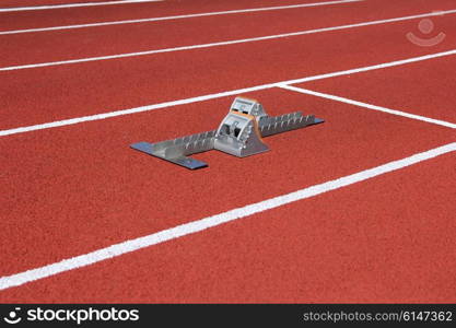 Athletics starting blocks on race track