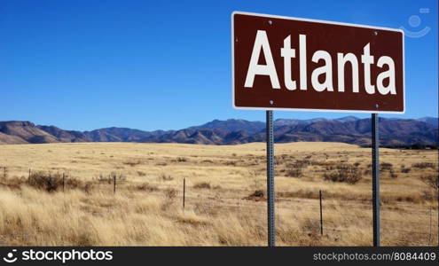 Atlanta road sign with blue sky and wilderness