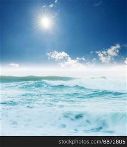 Atlantic ocean big waves seascape under blue sunny sky