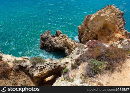 Atlantic ocean rocky coast view ( Lagos, Algarve, Portugal).