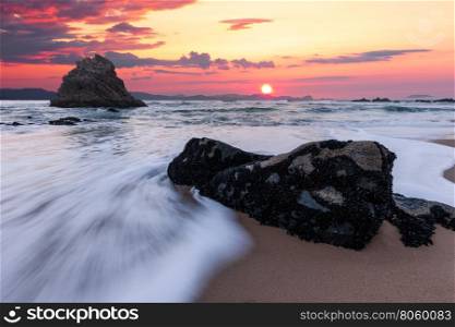 Atlantic ocean rocky coastline at sunrise