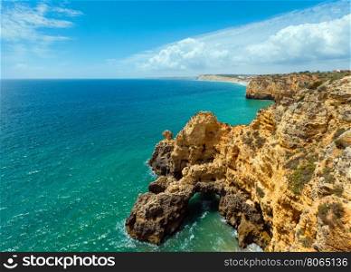 Atlantic ocean summer rocky coastline view (Lagos, Algarve, Portugal).