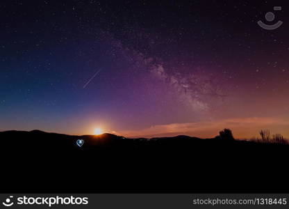 Atmospheric night in the Black Forest with a super full moon and the Milky Way.