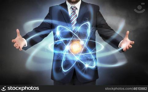 Atom molecule in hands. Close view of businessman and atom molecule