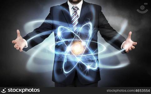 Atom molecule in hands. Close view of businessman and atom molecule
