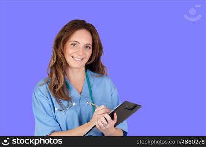 Atractive doctor girl with a clipboard on a blue background