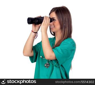 Atractive medical girl looking through binoculars isolated on white background