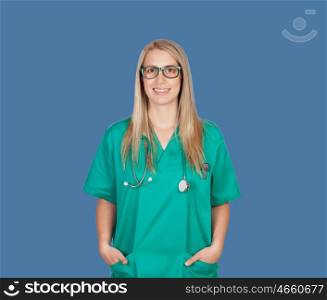 Atractive medical girl with glasses on a blue background