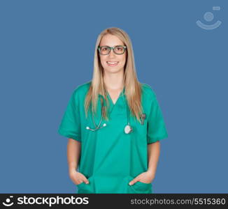 Atractive medical girl with glasses on a blue background