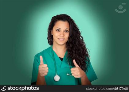 Atractive medical saying ok girl on gray background