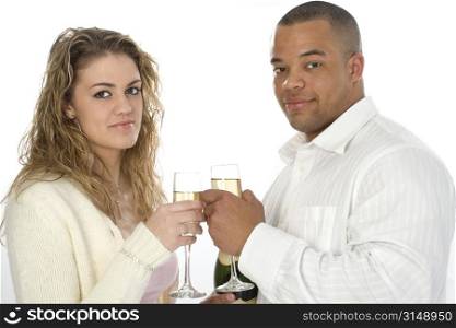 Atractive young couple with champange. Shot in studio.