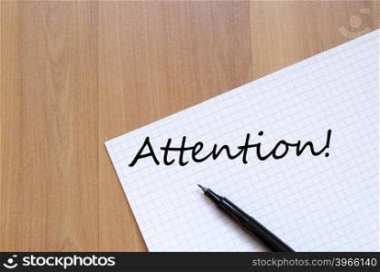 Attention text concept write on notebook