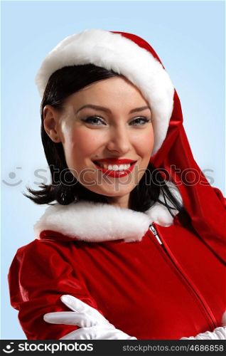 Attracive girl in santa clothes. Portrait of beautiful young woman wearing santa claus clothes