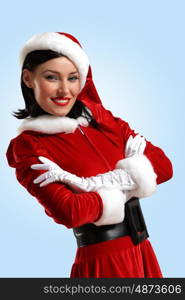 Attracive girl in santa clothes. Portrait of beautiful young woman wearing santa claus clothes