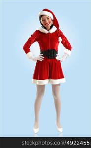 Attracive girl in santa clothes. Portrait of beautiful young woman wearing santa claus clothes