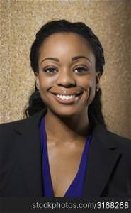Attractive African American businesswoman smiling at viewer.