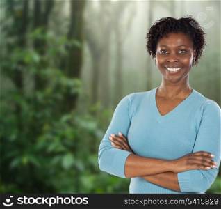 Attractive African woman in a tropical rainforest
