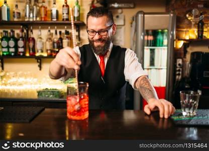 Attractive alcoholic drink preparation show. Professional bartending. Attractive alcoholic drink preparation show