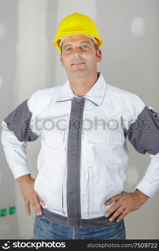 attractive and confident constructor looking at camera