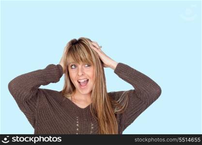 Attractive and crazy girl isolated on a blue background