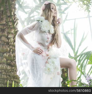 Attractive and delicate lady in the rain forest