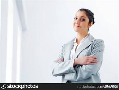 Attractive asian businesswoman in grey suit. Image of young asian businesswoman in grey suit