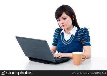 Attractive Asian girl using laptop over white background