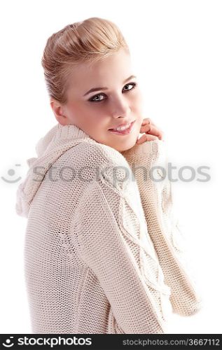 attractive beautiful woman wearing a white wool sweater in a fashion shot with an elegant up do