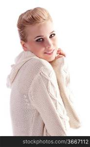 attractive beautiful woman wearing a white wool sweater in a fashion shot with an elegant up do