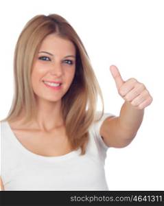 Attractive blond girl saying Ok with focus on the thumb isolated on a white background