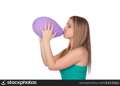 Attractive blond girl swelling a balloon isolated on white background