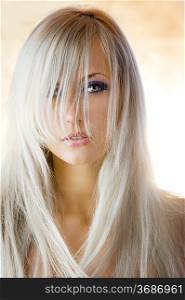 attractive blond girl with long hair in a fashion portrait