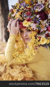 Attractive blond nymph wearing a flowery crown