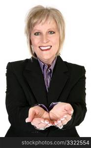 Attractive blond older woman in a business suit holding out cupped hands.
