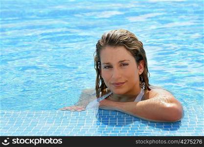 Attractive blond woman at a poolside