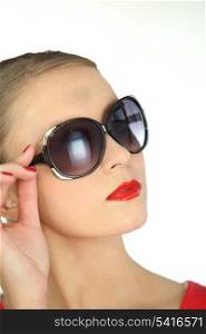 Attractive blond woman posing in sunglasses