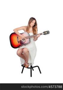 Attractive blond woman with a guitar isolated on a white background