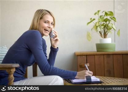 attractive blond woman working from home