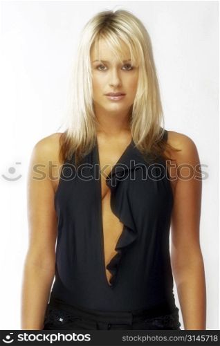 Attractive blonde business woman poses for the camera.