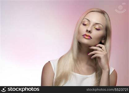 attractive blonde female posing with multicolor make-up, cute silky smooth hair and white dress